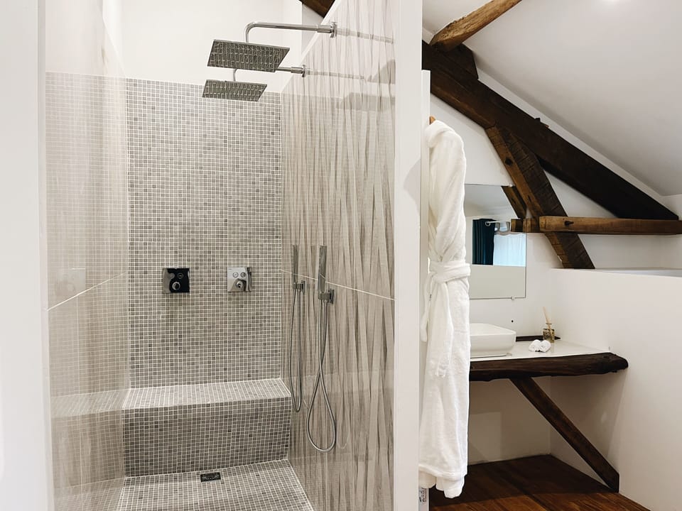 Deluxe Room | Bathroom | Designer toiletries, bathrobes, towels, soap