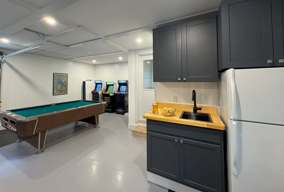Bar area includes a large refrigerator to ensure refreshments are always chilled