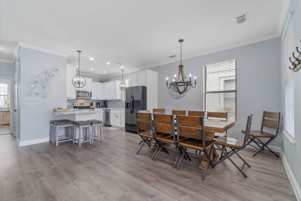 Dining room with seating for 10 and barstools at the kitchen counter