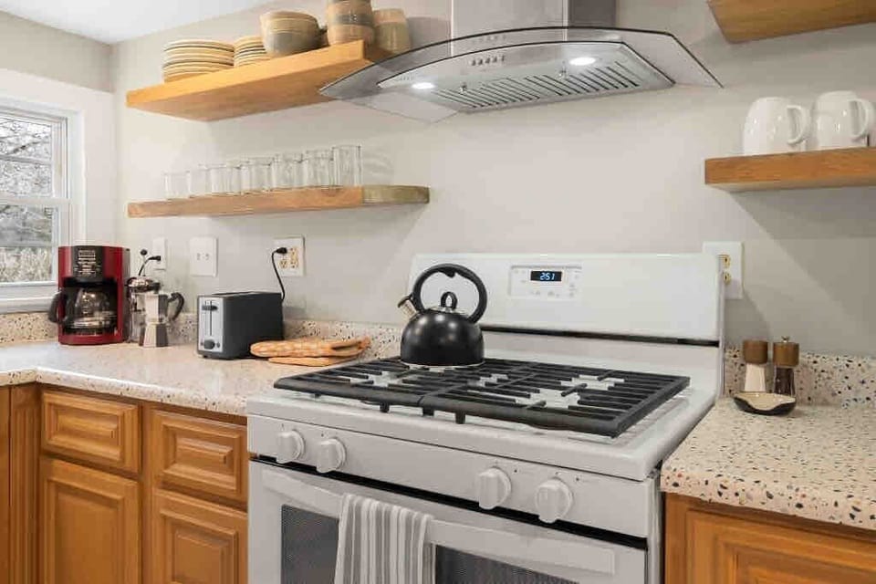 Open shelving keeps everyday essentials within easy reach for effortless meal prep. 