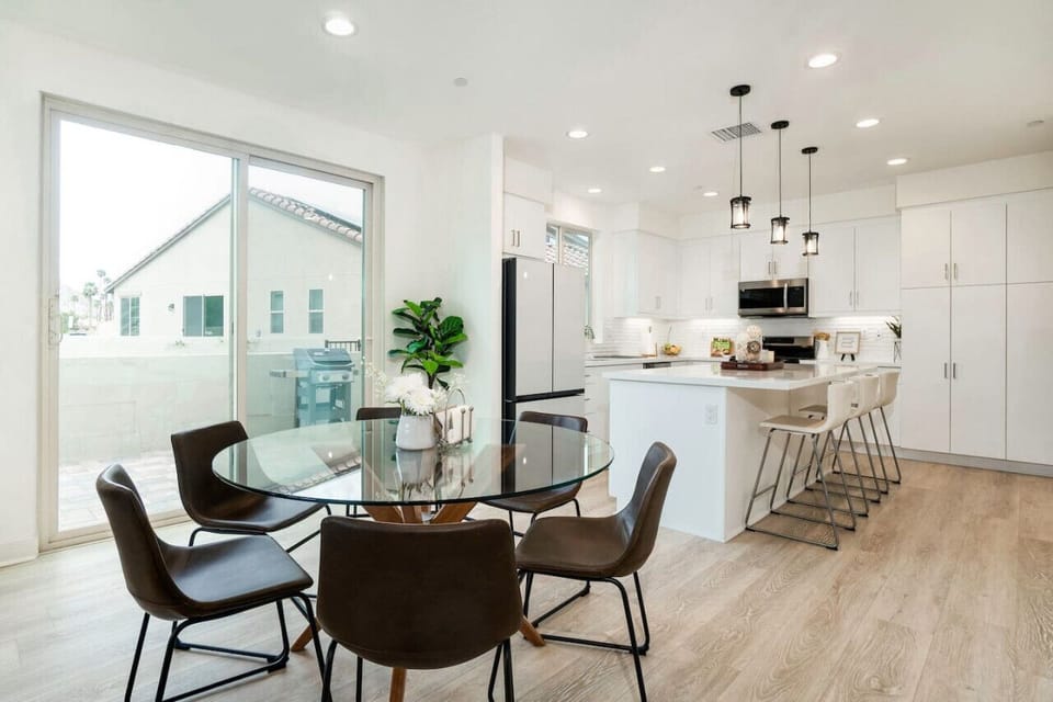 Open dining area flowing into a modern kitchen, perfect for easy meals together