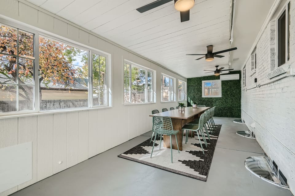 Sun room/dining room with seating for 12.