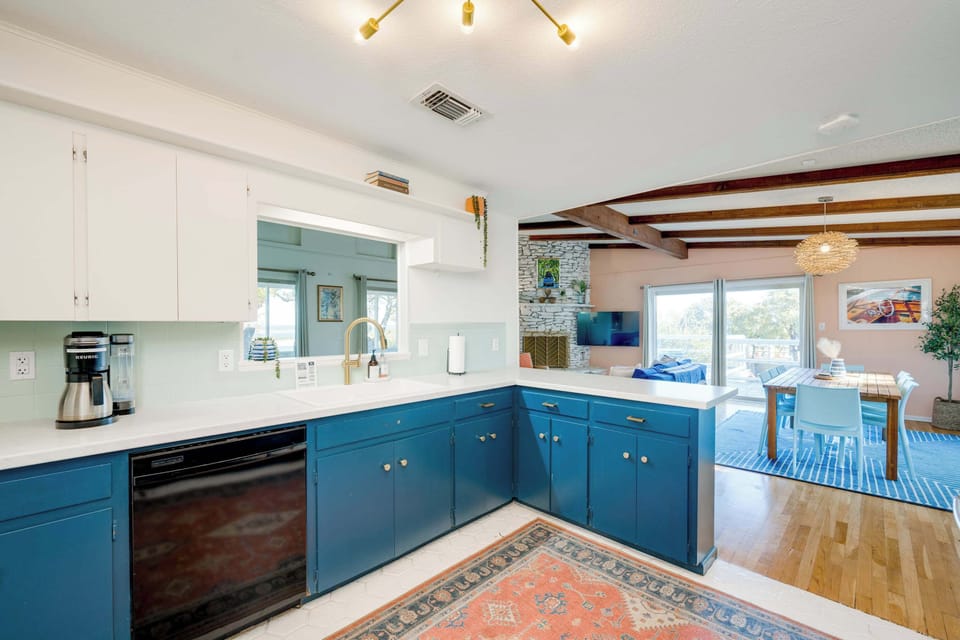 Kitchen with open concept to living and dining areas. Views of the lake from the sink!