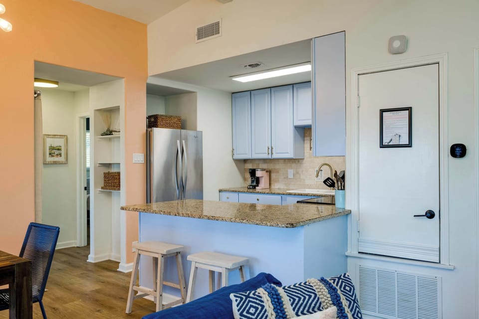 2 bar top seats to kitchen. Stocked kitchen with all the basics to cook meals!