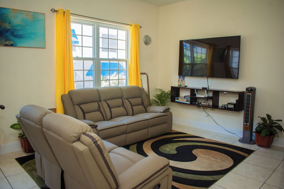 The living room and 65 inch Tv