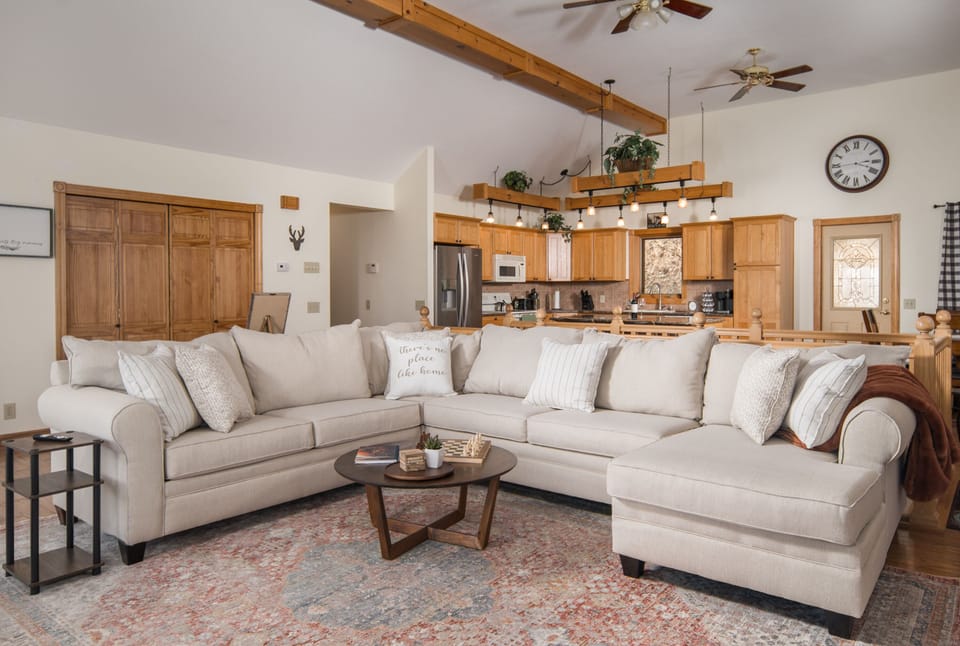 Plenty of seating to gather around the fireplace