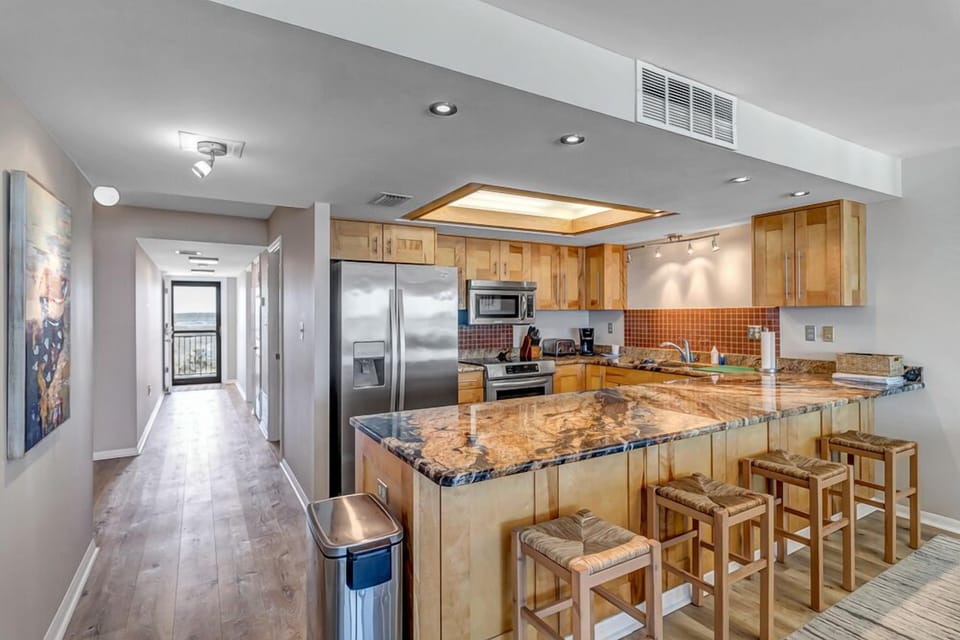 - Cook and connect in a stunning kitchen with granite countertops, stainless steel appliances, and a large breakfast bar
- Barstool seating makes meals and conversations flow easily
- Plenty of prep space keeps entertaining fun and stress free