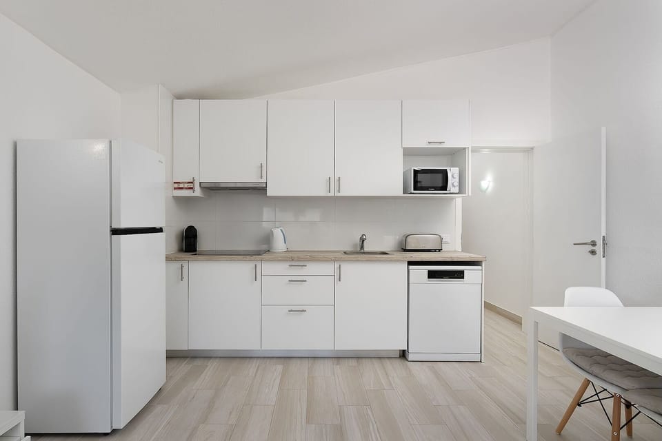 A fully equipped kitchenette with all the amenities you may require to prepare a delicious homecooked meal. #apartment #summer #comfort #algarve