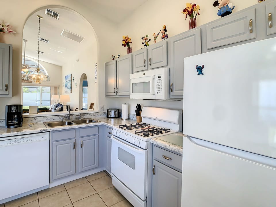 Modern kitchen with double sinks and ample counter space.