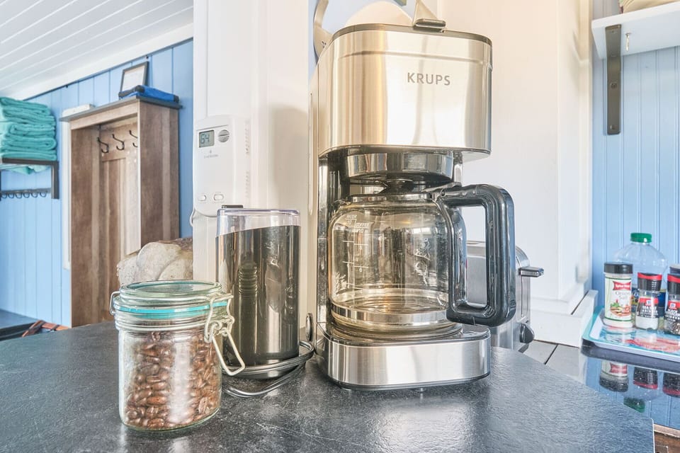 Your morning coffee is eagerly awaiting preparation, crafted from locally sourced and organic coffee beans.