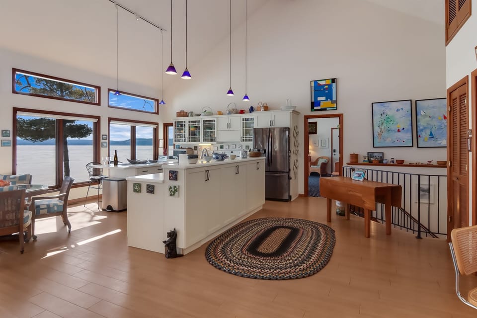 Light and bright kitchen with two large islands and, of course, lake views
