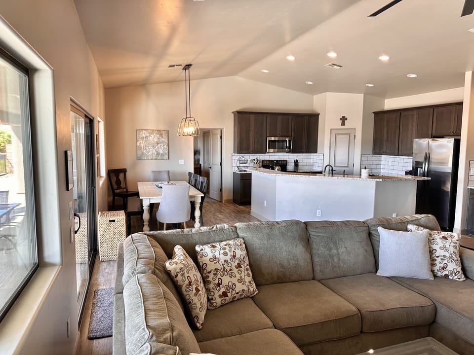 Slider to pool and patio, Junior Suite is through door off kitchen with bath
