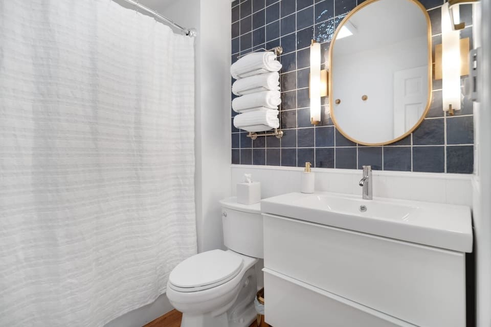 Bathroom vanity with round mirror