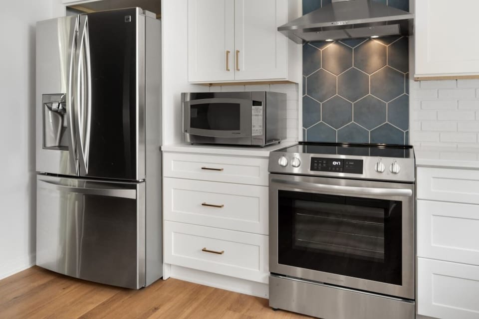 Unit 6466 (1 of 3) Modern kitchen with premium appliances, perfect for cooking enthusiasts. The hexagon tile backsplash adds a touch of elegance. ️✨