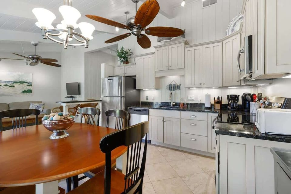 Your spacious kitchen features granite counters, stainless appliances, and a cozy dining area where you'll love gathering for memorable meals together.