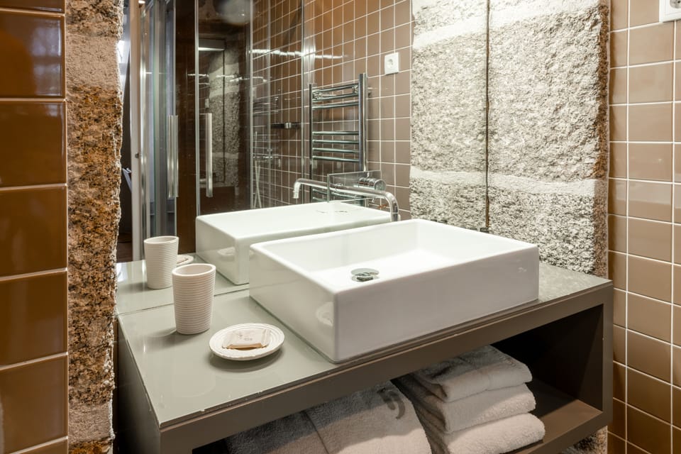 Suite, City View | Bathroom | Shower, free toiletries, hair dryer, bathrobes