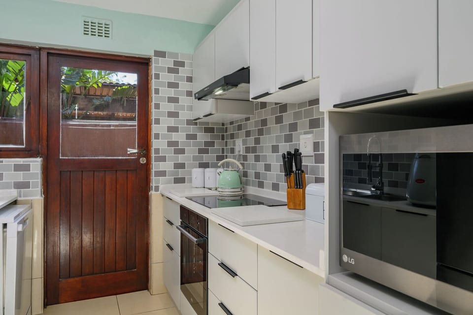 Standard Villa | Private kitchen | Electric kettle, dining tables