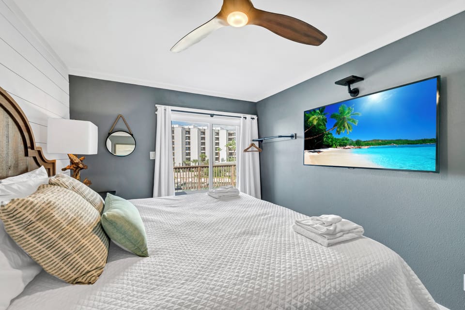 Drift into your peaceful retreat with soft linens, calming coastal colors, and a tropical view to inspire sweet dreams.