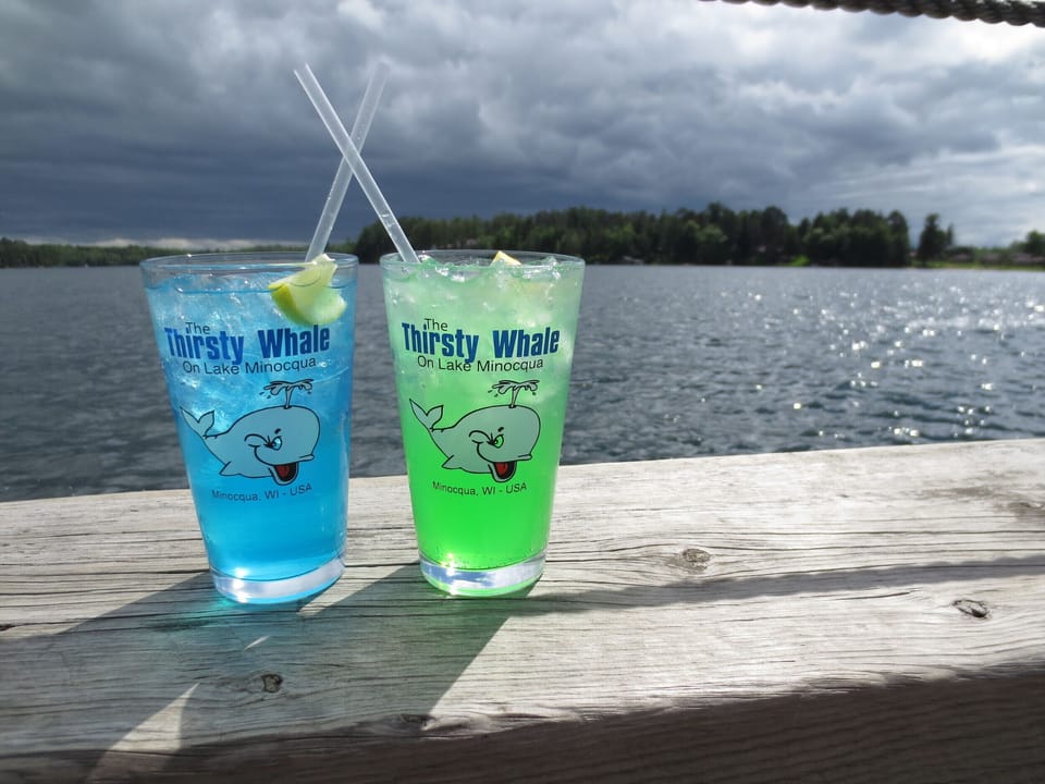 Enjoy a cocktail, food, and the amazing view from the Thirsty Whale's wrap around deck in Minocqua.