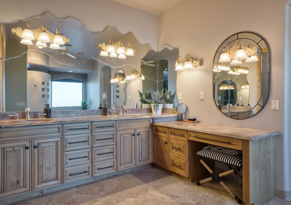 Primary bathroom #1 - features dual sinks, vanity, walk in shower, & jetted tub.