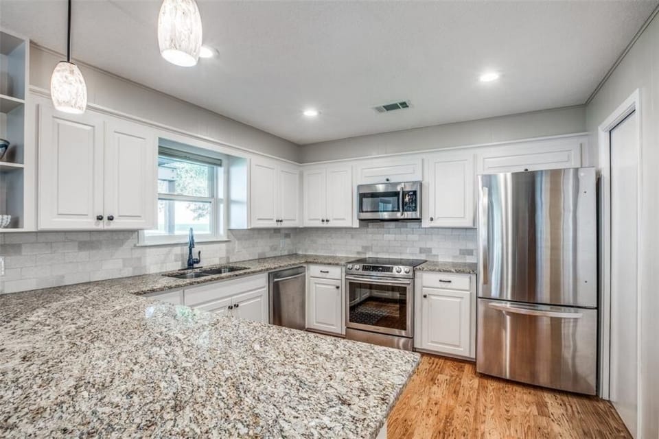Updated kitchen with stainless steel appliances.