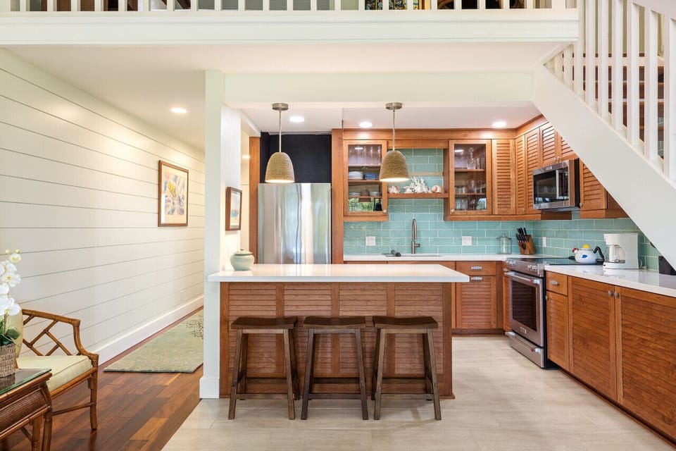 Warm, open kitchen & dining space ready for shared meals after a day in the sun.