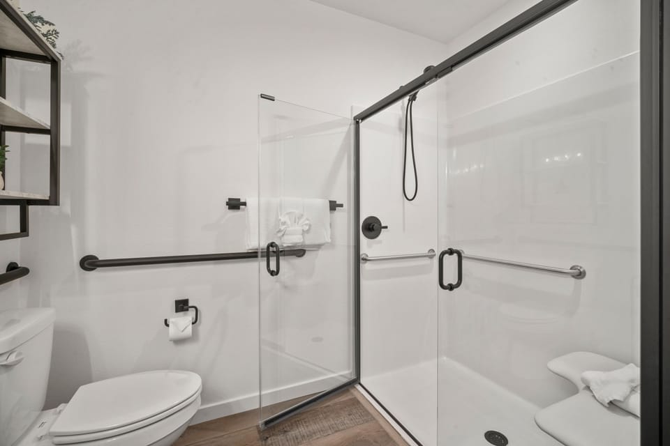 Bathroom 1, Attached to Bedroom 1- Roll Under Sink, Step-In Shower, Handicap Friendly Features