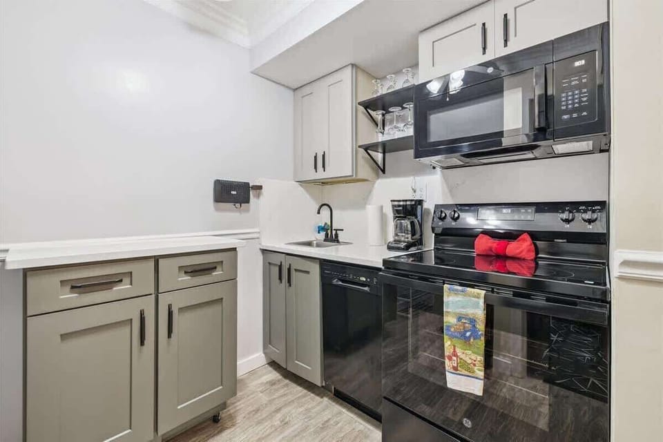 Kitchen: Modern appliances and stylish decor make cooking a delight in this chic space!