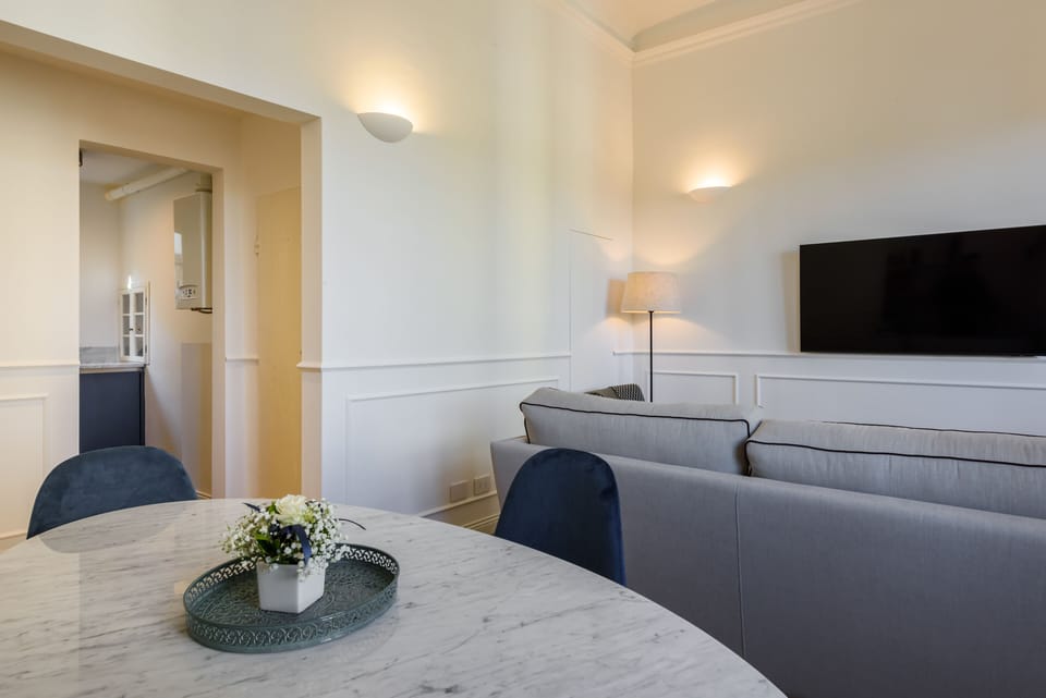 Luxury Apartment | Living area | 40-inch flat-screen TV with digital channels, TV