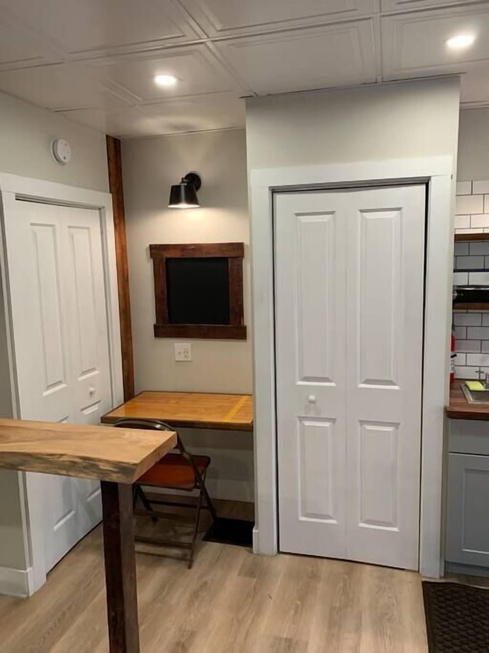 A shot of the bar, and murphy desk area.  Also pictured is the closet and the laundry closet. 