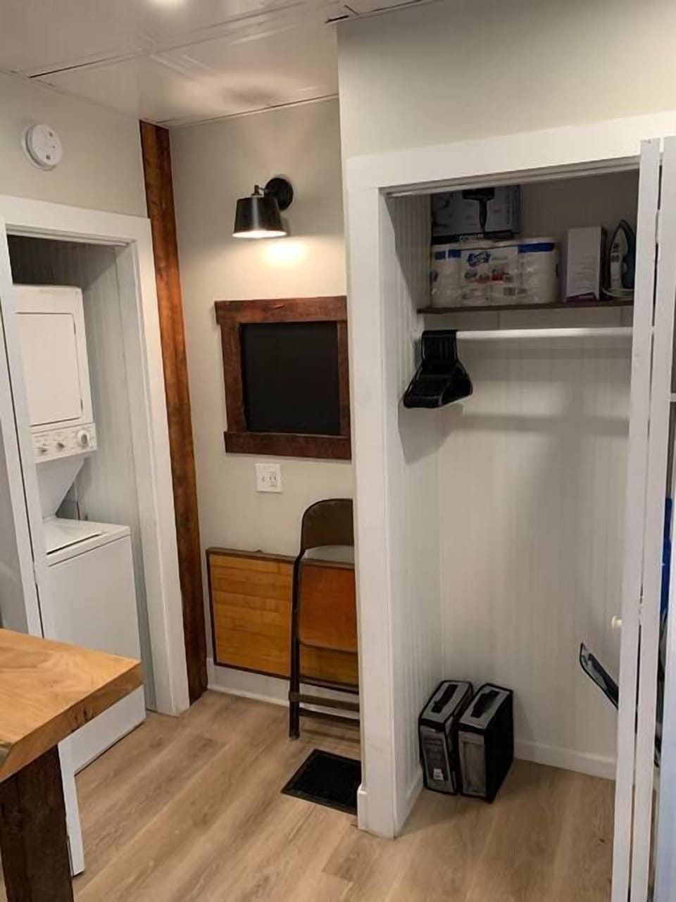 A shot of the murphy desk folded up for more space, as well as views of the laundry closet and main living closet. 