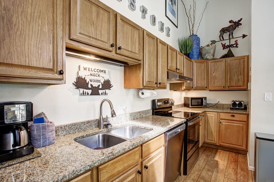 Granite countertops, dishwasher, and modern appliances for easy meals.
