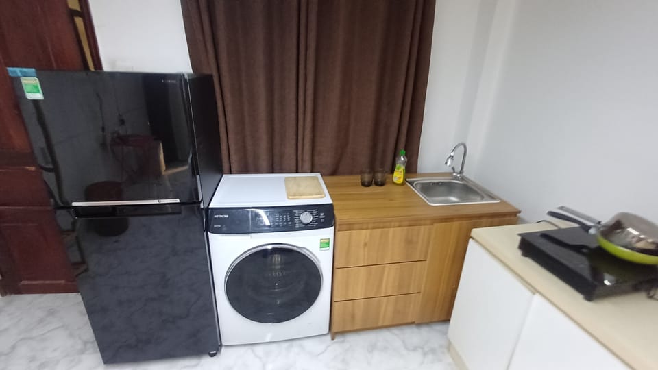 Mini-fridge, microwave, electric kettle, cleaning supplies