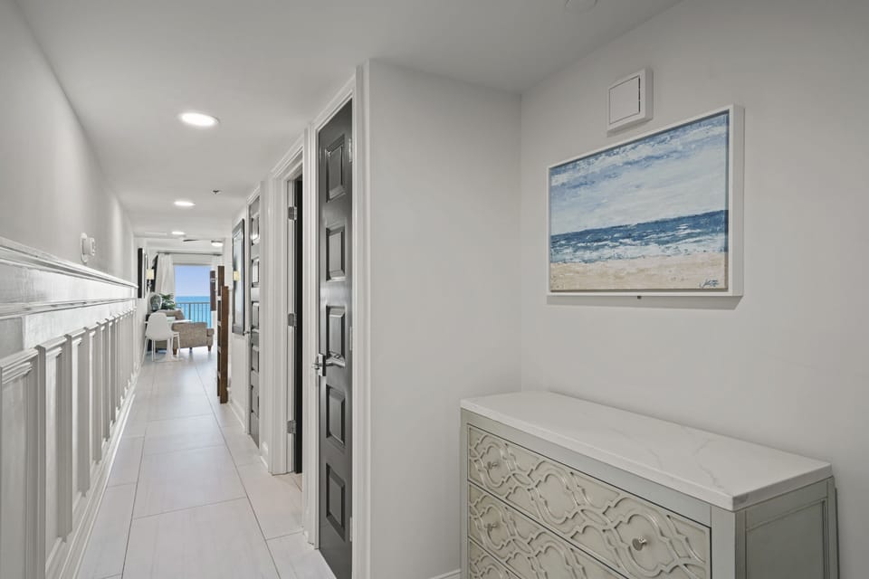 Spacious interior corridor leading toward balcony and Gulf views