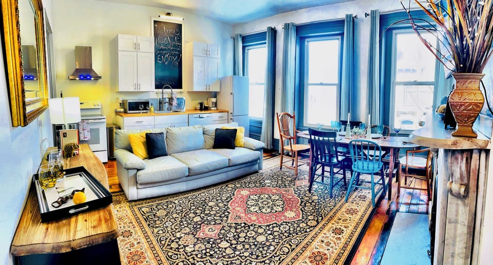 Large windows add to the charm of the great room and provide natural lighting.