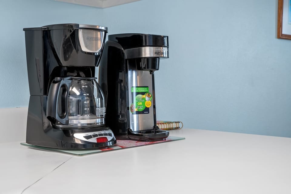 Coffee drinkers can enjoy either a regular drip coffee maker, or a Keurig machine.