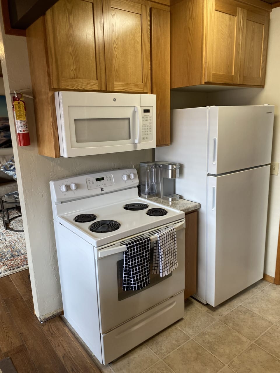 Fully equipped kitchen with a complete set of dishes/glassware, pots, and pans