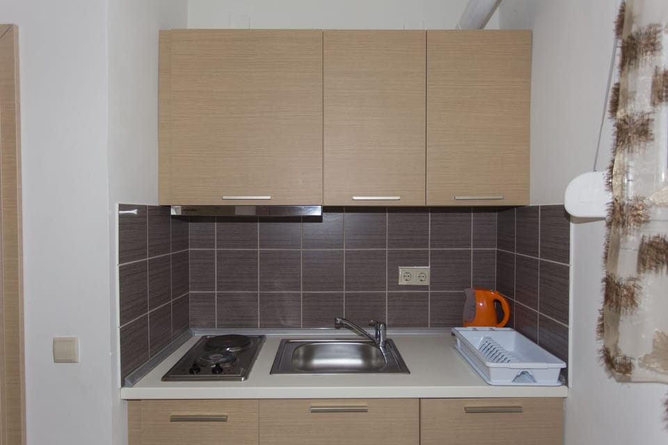 Triple Room, Garden View | Private kitchen | Coffee/tea maker, fridge