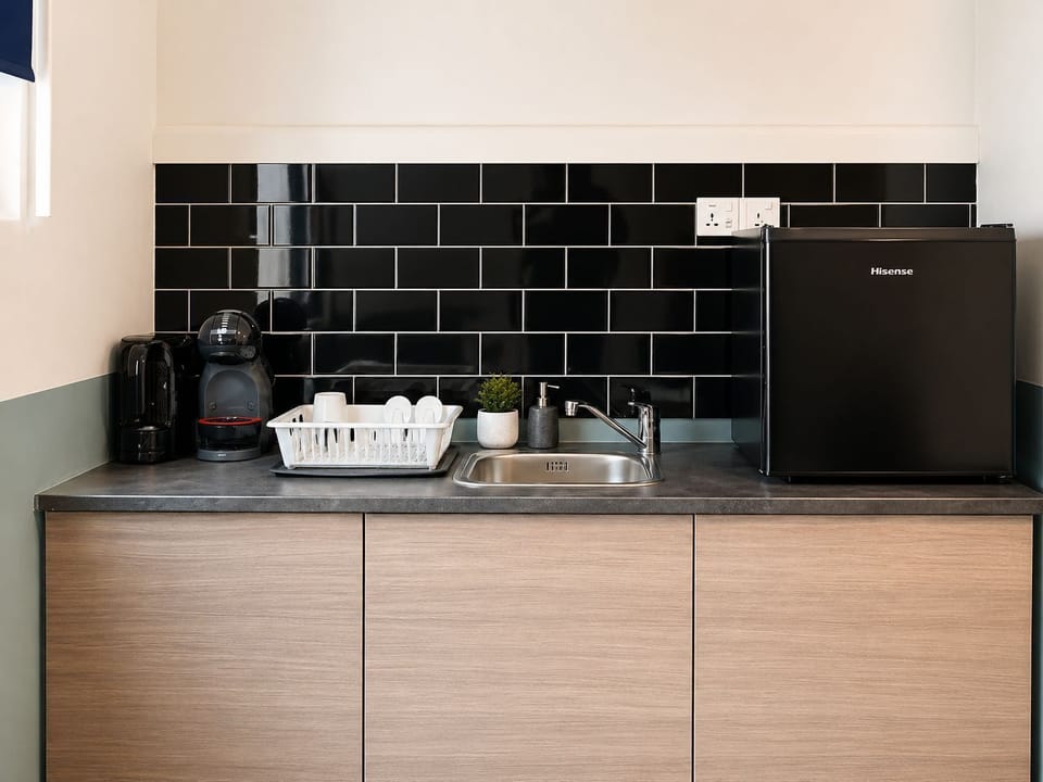 Mini-fridge, coffee/tea maker, electric kettle, dining tables