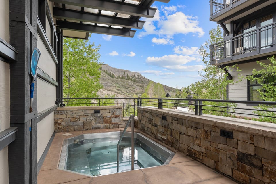 Enjoy blue skies and the rustling of leaves from the comfort of the common area hot tub on site.