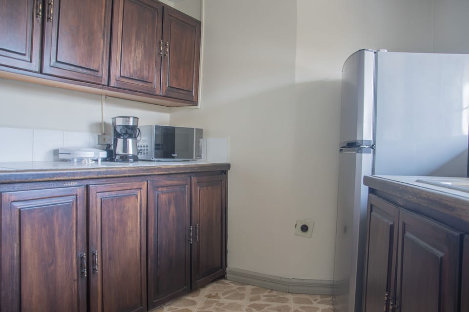 Shared fridge, microwave, coffee/tea maker, dining tables