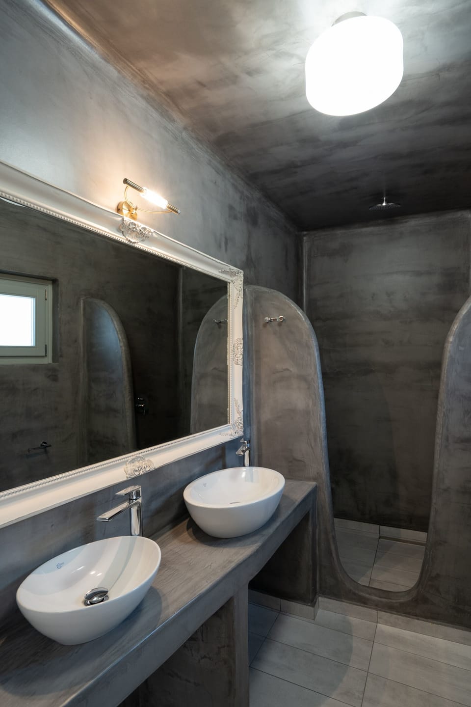 Black Occhio Villa | Bathroom | Rainfall showerhead, free toiletries, hair dryer, bidet