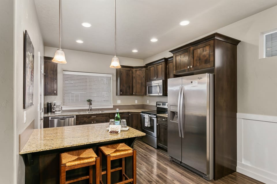Luxury kitchen with granite counters, stainless appliances and real solid wood cabinets.