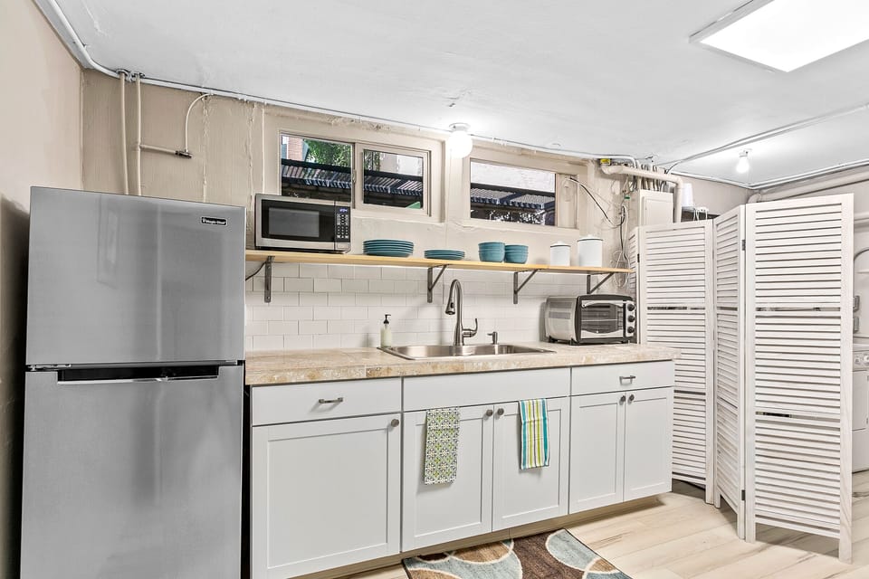 A second mini-kitchen is on the basement level making this home great for two families or groups.