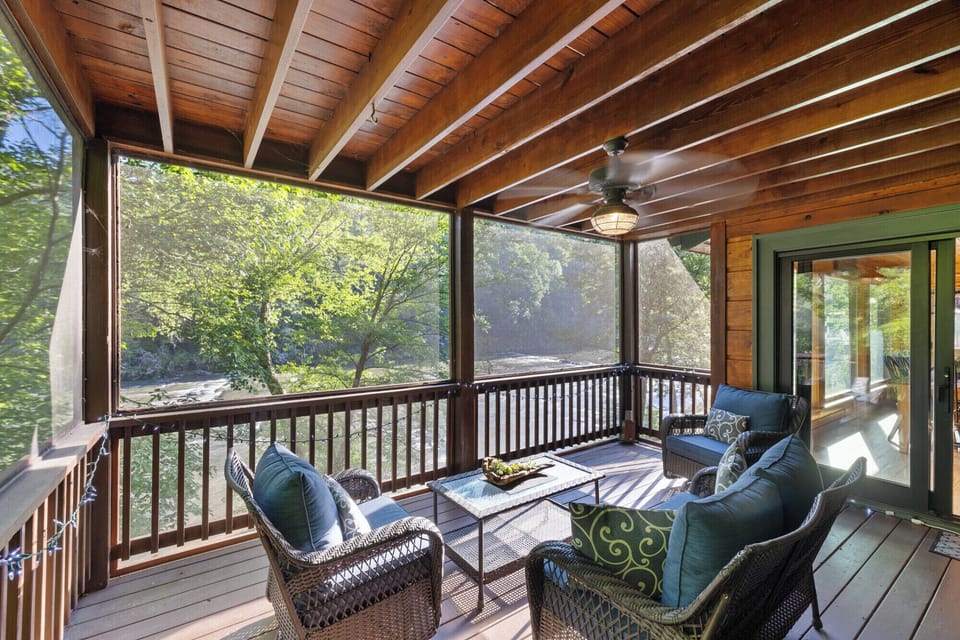There is a large screened porch with seating off the main floor living are with a lovely view of the Coosawattee River