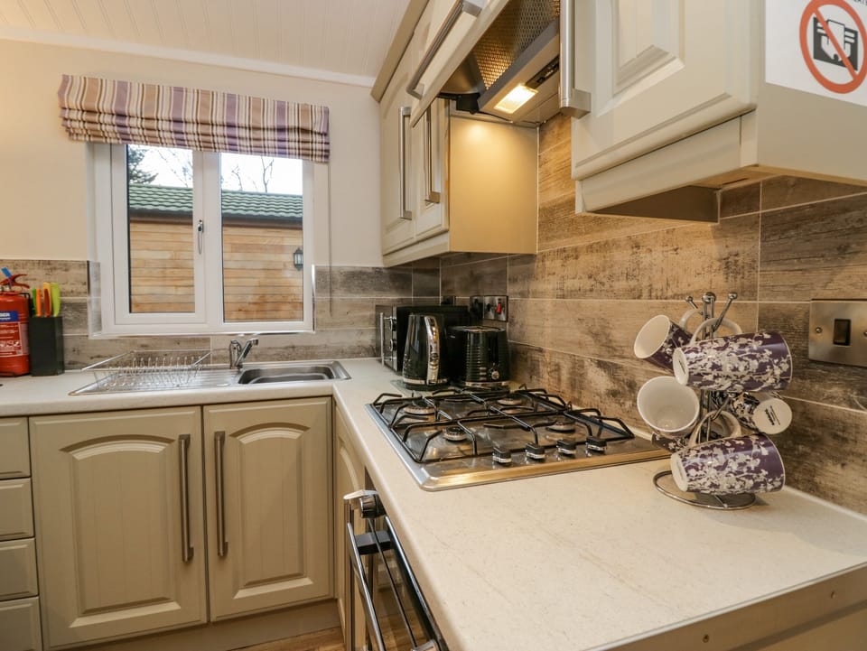 Fridge, electric kettle, toaster, cookware/dishes/utensils