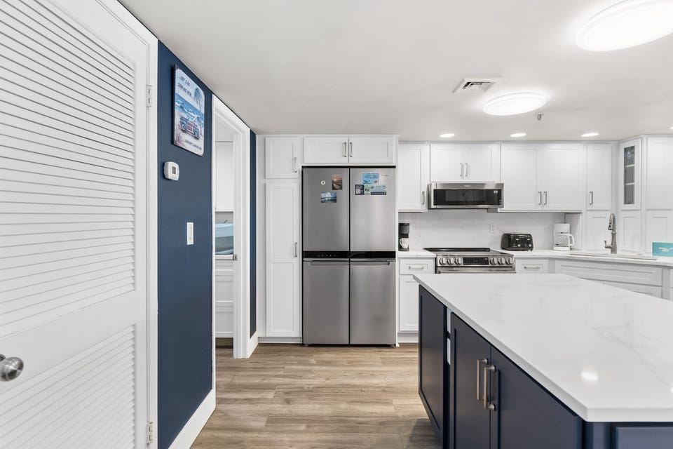 Kitchen - Warm, welcoming kitchen with marble counters and an island—ideal for easy meals