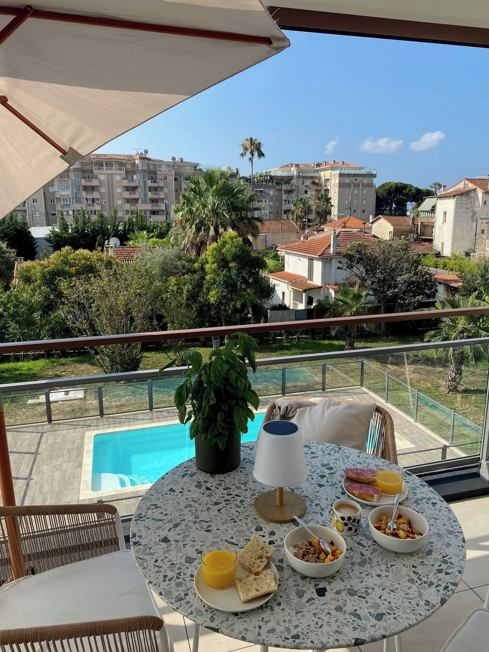 The balcony with the pool in the background