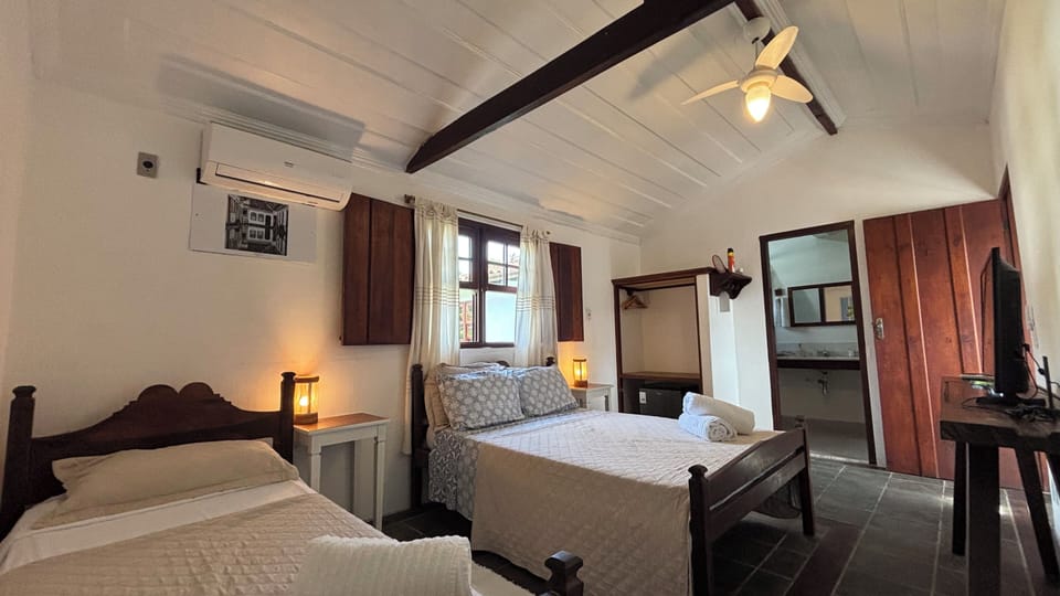 Classic Triple Room, Multiple Beds | Minibar, desk, laptop workspace, free WiFi