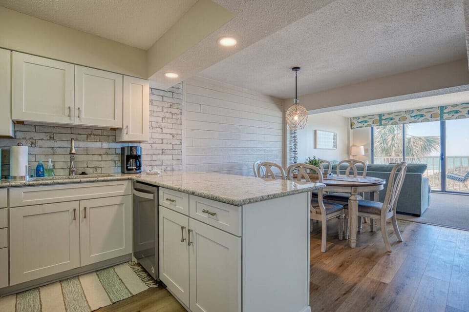 Fully equipped kitchen.  Prepare your meal and dine while staring at the waves.